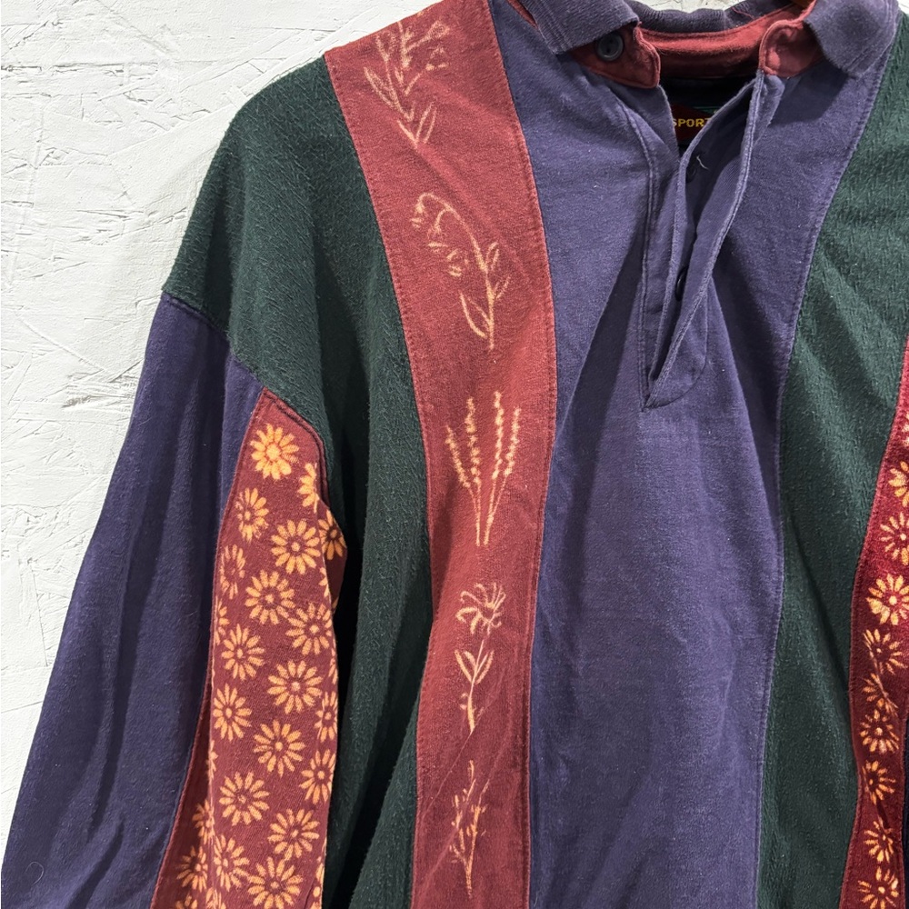 Multicolored one of a kind shirt with hand bleached floral design.